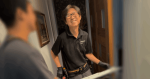 Shaun in a work uniform with a tool belt, representing a hands-on career in skilled service trades.