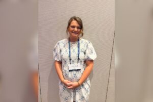Health coach career inspiration — Alora, a health coach who turned her personal wellness journey into a new career, at an industry event